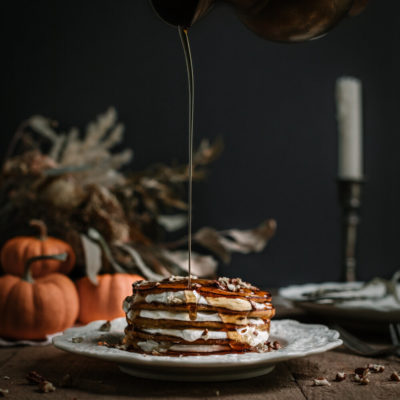 Pumpkin Pancakes with Cinnamon Spiced Whipped Cream and Toasted Pecans